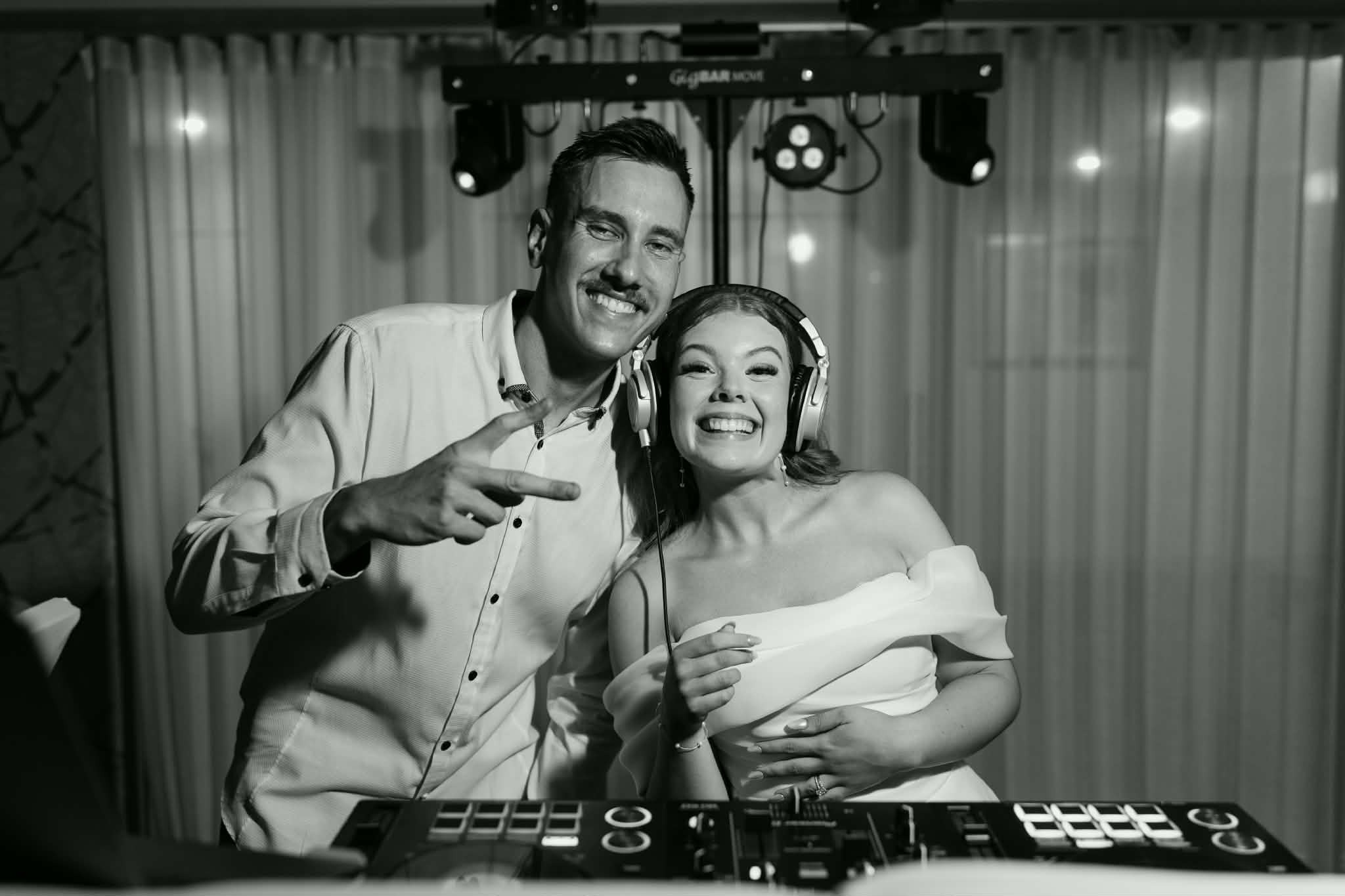 Bride and groom at the DJ booth