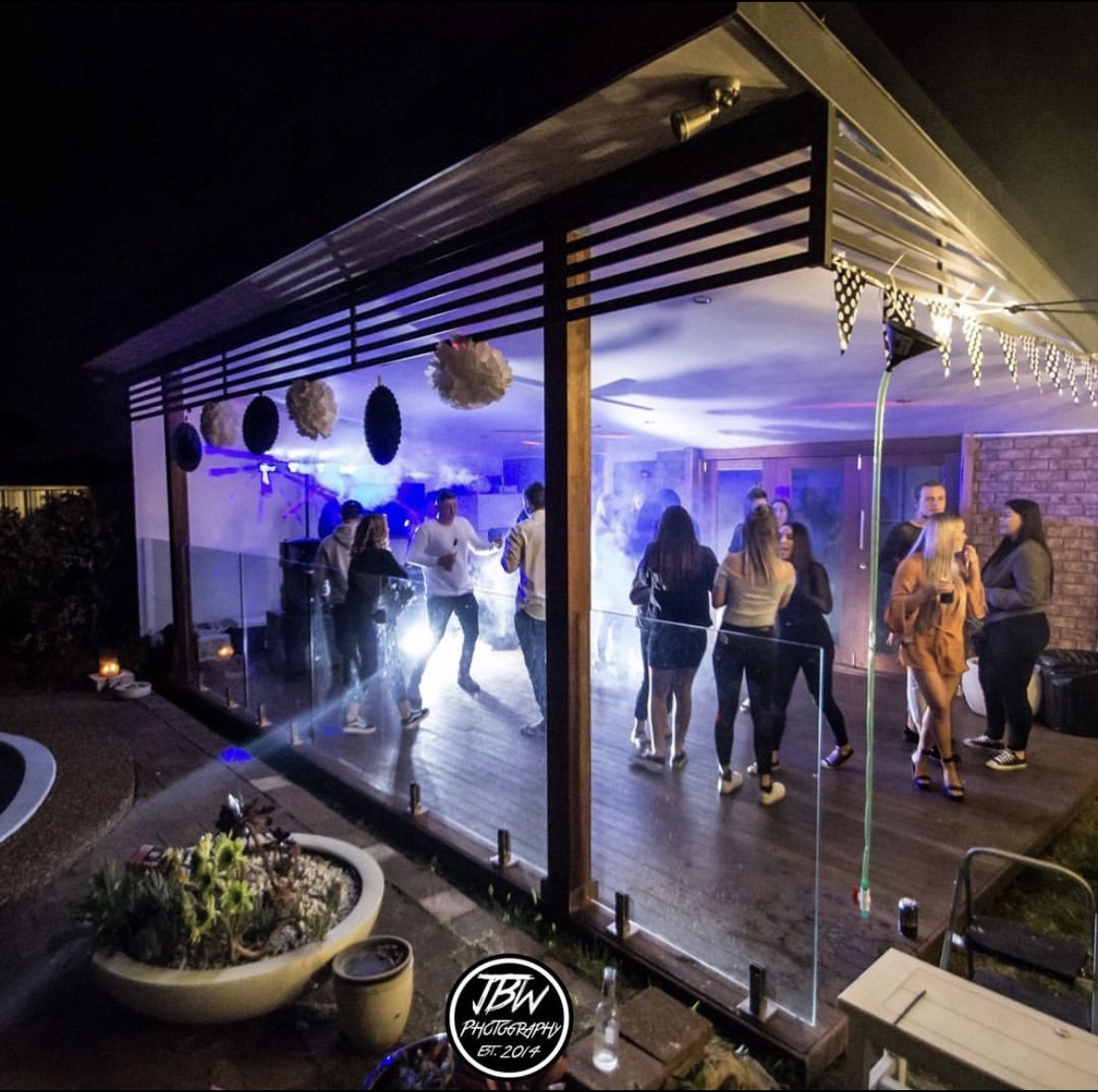 Guests dancing in an outdoor pavilion